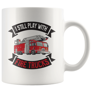 I Still Play With Fire Trucks Mug
